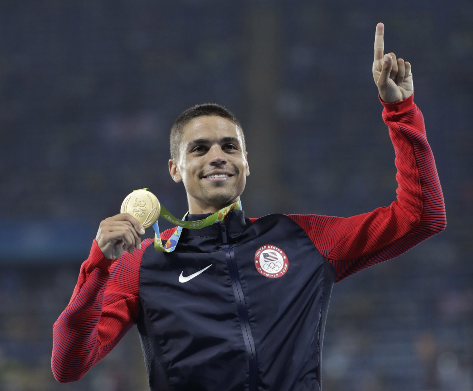 United States' Matthew Centrowitz celebrates on the podium after winning the men's 1500-meter final during athletics competitions at the Summer Olympics inside Olympic stadium in Rio de Janeiro, Brazil, Saturday, Aug. 20, 2016. (AP Photo/Jae C. Hong)
