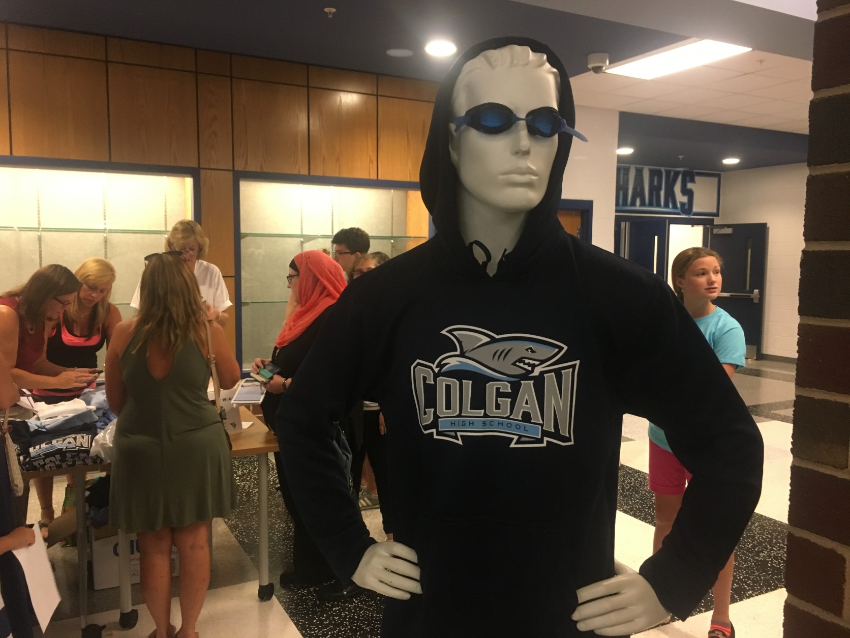 Students purchased sweaters and T-shirts featuring the schools logo and mascot, the shark. (Courtesy Colgan High School)