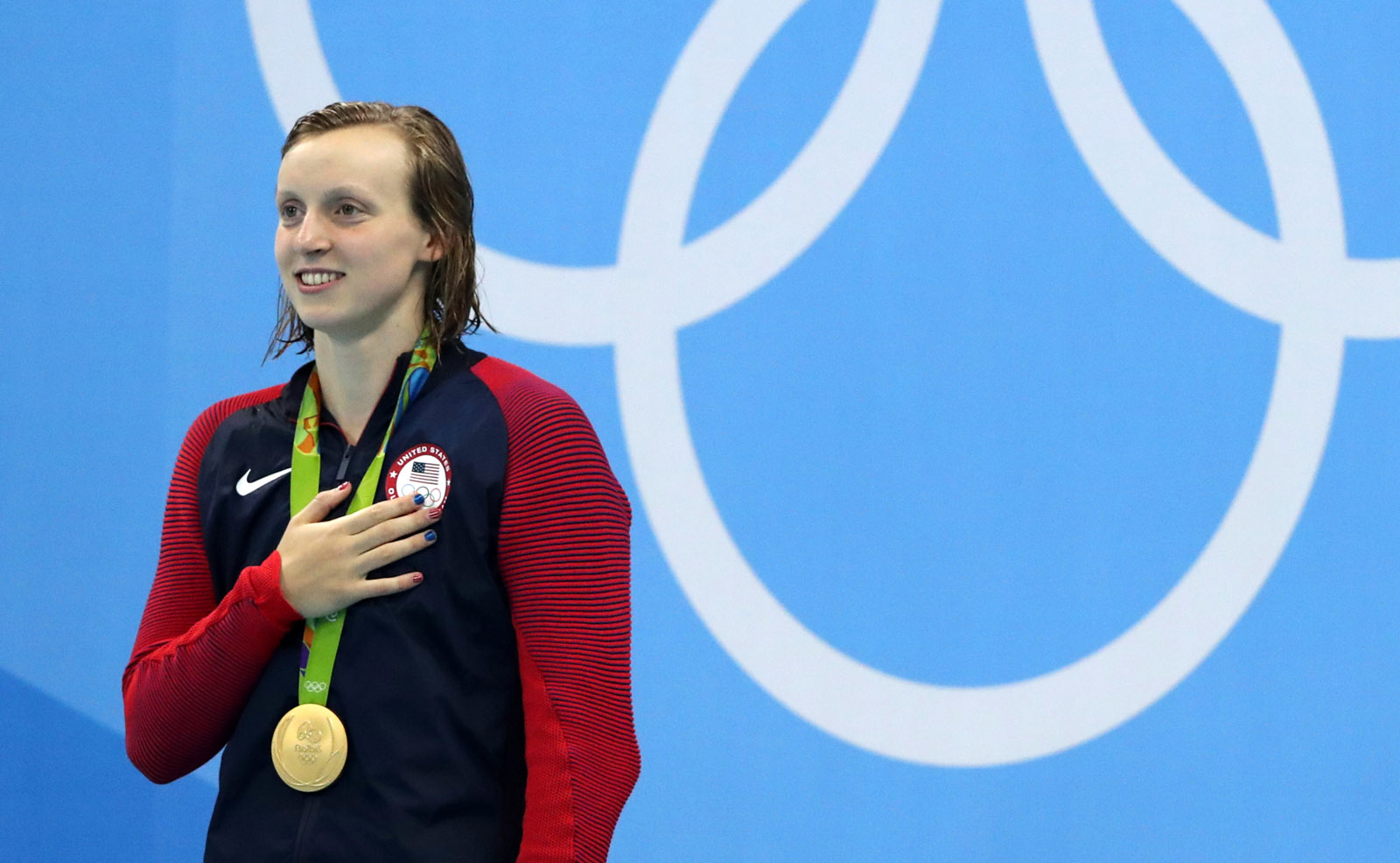 United States' Katie Ledecky listens to the national anthem after winning gold in the women's 200-meter freestyle during the swimming competitions at the 2016 Summer Olympics, Tuesday, Aug. 9, 2016, in Rio de Janeiro, Brazil. (AP Photo/Lee Jin-man)