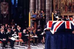 Charles, Prince of Wales, speaks at the lectern with other members of the British royal family in attendance at the Westiminster Abbey funeral service for Lord Louis Mountbatten in London on Sept. 5, 1979. Lord Mountbatten, great-uncle to Prince Charles, was one of the victims of a terrorist bomb attack on his boating party off the coast of Ireland. (AP Photo)