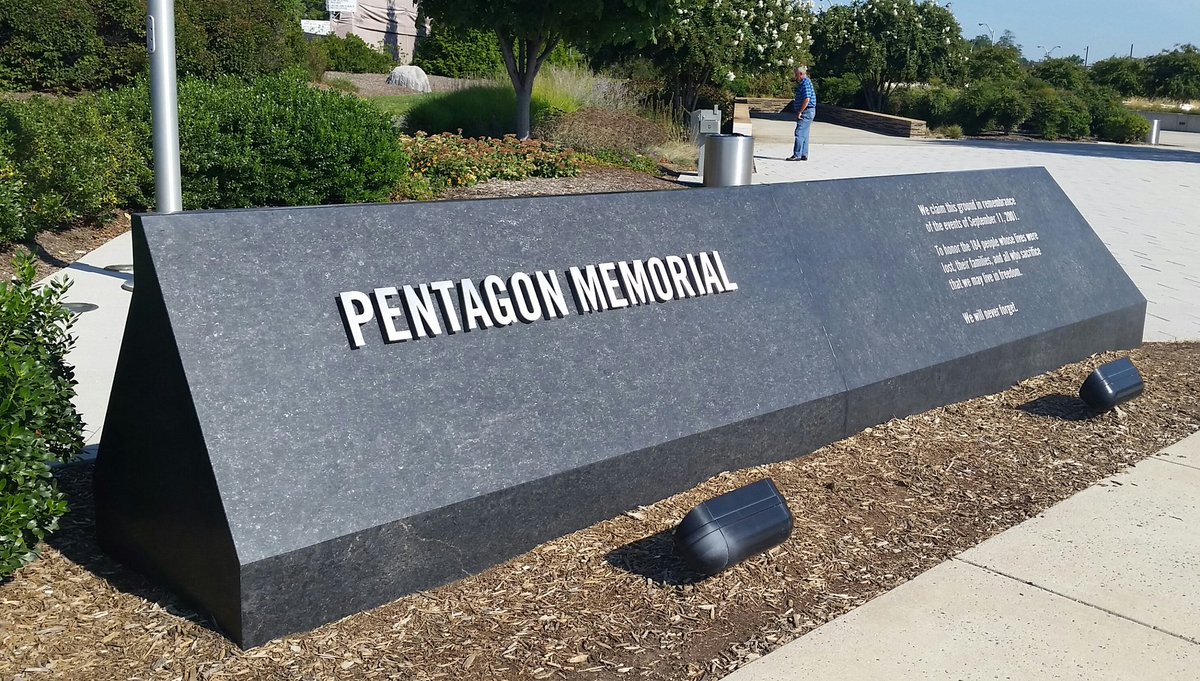 Firefighters and volunteers gathered near the Pentagon Memorial on Saturday, August 27, 2016. They took a photo to honor the 15-year anniversary of the 9/11 attack on the Pentagon. (WTOP/Kathy Stewart)