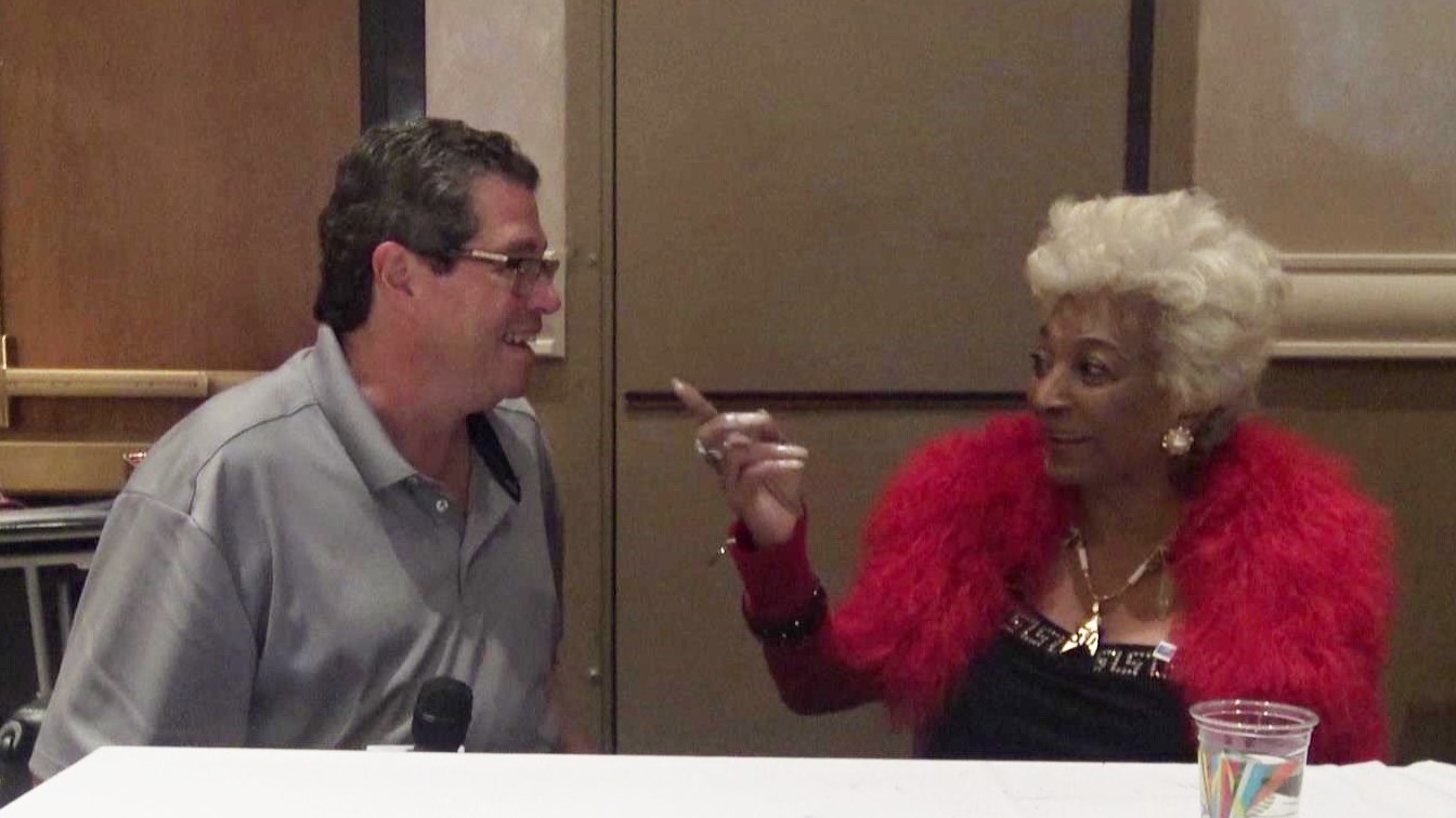 A WTOP contributor speaks with Nichelle Nichols, who played Uhura. Fan meetings with the "Star Trek" stars are worth the dough, many convention attendees say. (WTOP/Steve Winter)