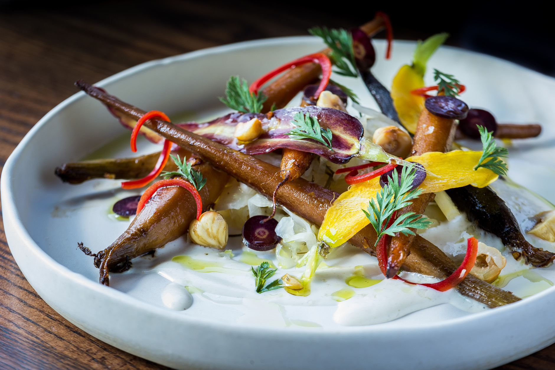 At D.C.'s new restaurant, Hazel, the focus is on duck. But that doesn't mean you can't find vegetables on the menu. Pictured: barbecued carrots with fennel kraut, hazelnuts and buttermilk. (Courtesy Rey Lopez)