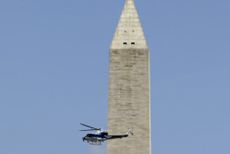 In this file photo, a U.S. Park Service helicopter flies in front of the Washington Monument in Washington, on Aug. 23, 2011, after it was evacuated following an earthquake in the Washington area. White marble and mortar on the 555-foot obelisk cracked and shook loose during the quake. Repairs to the stone cost $15 million but didn't address the elevator that takes tourists up to the observation deck inside. National Park Service officials believe that damage from the quake is likely contributing to ongoing mechanical problems with the elevator. (AP Photo/Jacquelyn Martin)