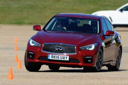 BEDFORD, ENGLAND - JUNE 30:  Guests drive an Infiniti Q50 through a slalom as they test the handling during the Infiniti Track Driving Experince at Millbrook Proving Ground on June 30, 2015 in Bedford, England.  (Photo by Christopher Lee/Getty Images for Infiniti Red Bull)