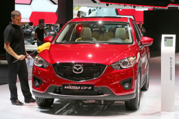 FILE - In this Thursday, Oct. 2, 2014, file photo, a Mazda CX-5 is presented at the Paris Motor Show, in Paris. Mazda announced Monday, Feb. 8, 2016, that the company is recalling  nearly 237,000 CX-5 SUVs from the 2014 and 2015 model years because the fuel filler pipe can rupture in a rear crash and cause a gas leak and possible fire. (AP Photo/Remy de la Mauviniere, File)