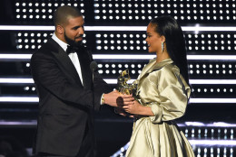 In this Aug. 28, 2016, file photo, Drake, left, presents the Michael Jackson Video Vanguard Award to Rihanna at the MTV Video Music Awards at Madison Square Garden in New York. Collectively, the pair accounted for nearly half of the top 10 most-streamed songs on music streaming site Spotify this summer.  (Photo by Charles Sykes/Invision/AP, File)