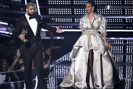 Drake, left, presents the Michael Jackson Video Vanguard Award to Rihanna at the MTV Video Music Awards at Madison Square Garden on Sunday, Aug. 28, 2016, in New York. Their collaboration "Too Good" was the second most listened-to song on the Spotify music-streaming service between June and August. (Photo by Chris Pizzello/Invision/AP)