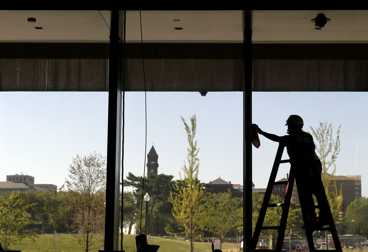 A worker cleans a window at the National Museum of African American History and Culture in Washington, Wednesday, Sept. 14, 2016, during a press preview. (AP Photo/Susan Walsh)