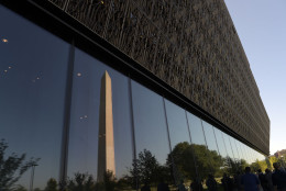 The Washington Monument is reflected in a window of the National Museum of African American History and Culture in Washington, Wednesday, Sept. 14, 2016, during a press preview. (AP Photo/Susan Walsh)