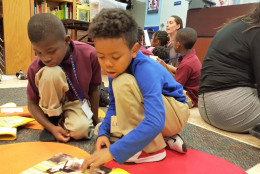 Boys at the Alexandria Redevelopment and Housing Authority participate in The Reading Connection's Read-Aloud program that runs in 12 sites region wide. (Courtesy The Reading Connection)