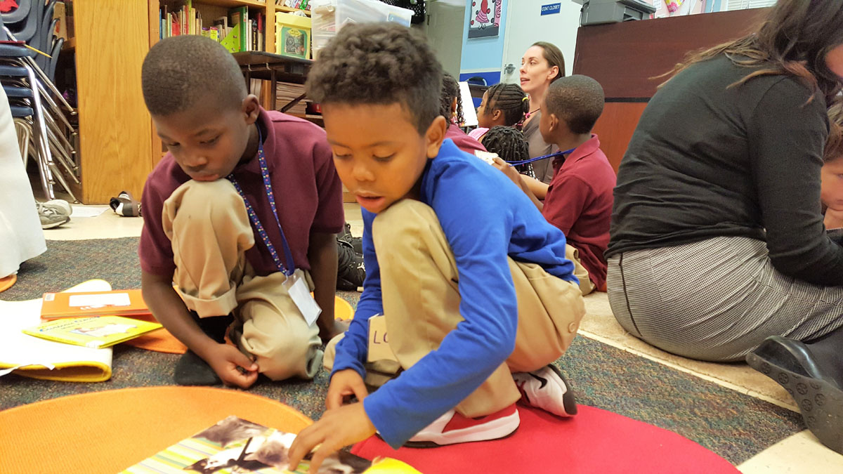 Boys at the Alexandria Redevelopment and Housing Authority participate in The Reading Connection's Read-Aloud program that runs in 12 sites region wide. (Courtesy The Reading Connection)