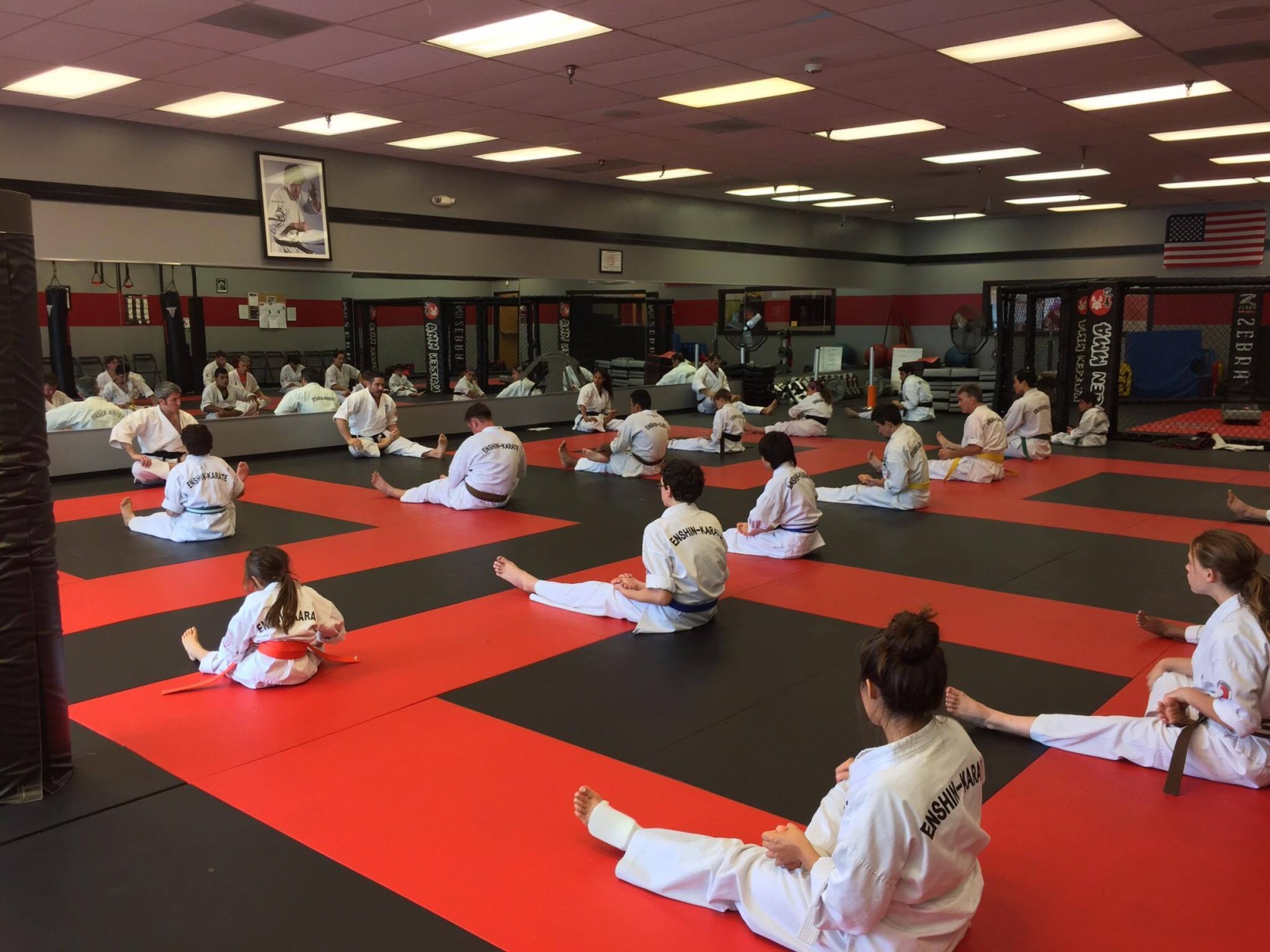 A class stretches on the mats at one of Enshin Karate's Northern Virginia locations. (Courtesy Nima Mazhari)