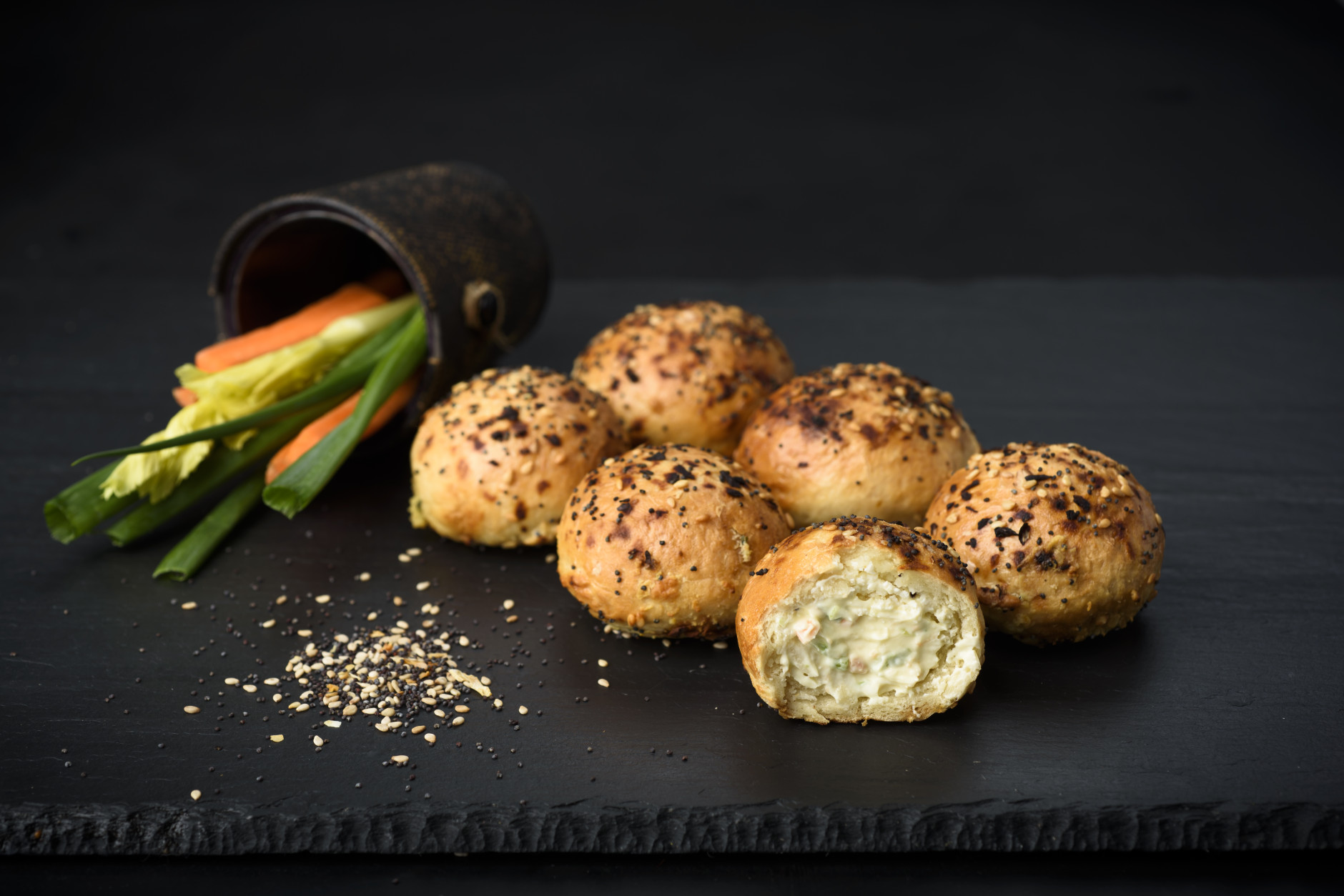 December 15, 2015 - New York, NY : Bantam Bagels "everybody's favorite" bagel balls photographed with vegetables and sesame seeds, for use on product packaging.