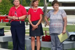Laurie Laychak, middle, attends the 9/11 Memorial in Prince William County on Friday. (WTOP/Kathy Stewart) 