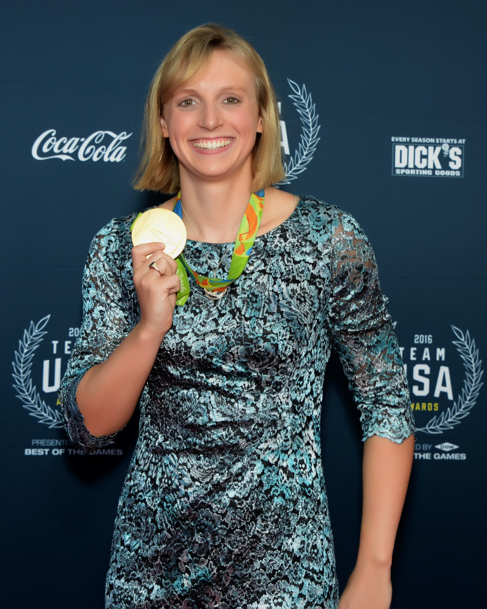Katie Ledecky poses with one of her gold medals on the red carpet of the Team USA Awards. (Courtesy Shannon Finney, <a href="http://www.shannonfinneyphotography.com">www.shannonfinneyphotography.com</a>)