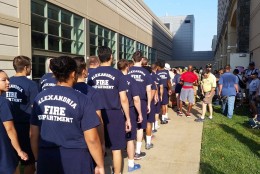 Members of the Alexandria Fire Department line up at the 9/11 Memorial Stair Climb event Saturday at National Harbor. (WTOP/Kathy Stewart)