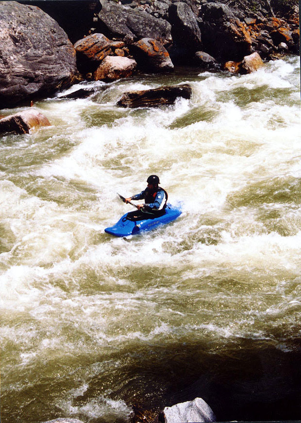 A kayaker paddles through rapids on the Gallatin River near Big Sky, Mont., June 23, 2004. Some conservationists in the Big Sky area have been trying to get further protection for the river. (AP Photo/Sarah R. Craig)