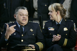 Outgoing Washington Police Chief Charles H. Ramsey, left, sits with incoming Washington police Chief Cathy Lanier, right, before giving out presents to school children to kick-off the annual U.S. Marines Toys-for-Tots drive, Tuesday, Nov. 21, 2006 at Union Station in Washington.  (AP Photo/Pablo Martinez Monsivais)