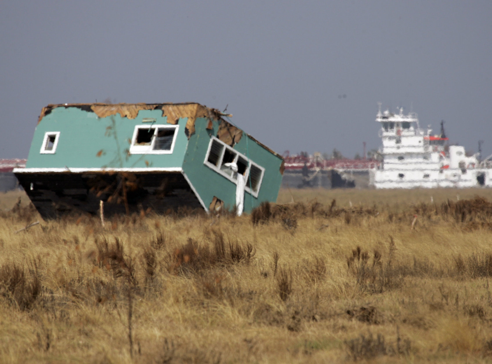A house sits upside down in a field Friday, Sept. 26, 2008 in Crystal Beach, Texas, nearly two weeks after Hurricane Ike struck the Texas Gulf coast. (AP Photo/Pat Sullivan)