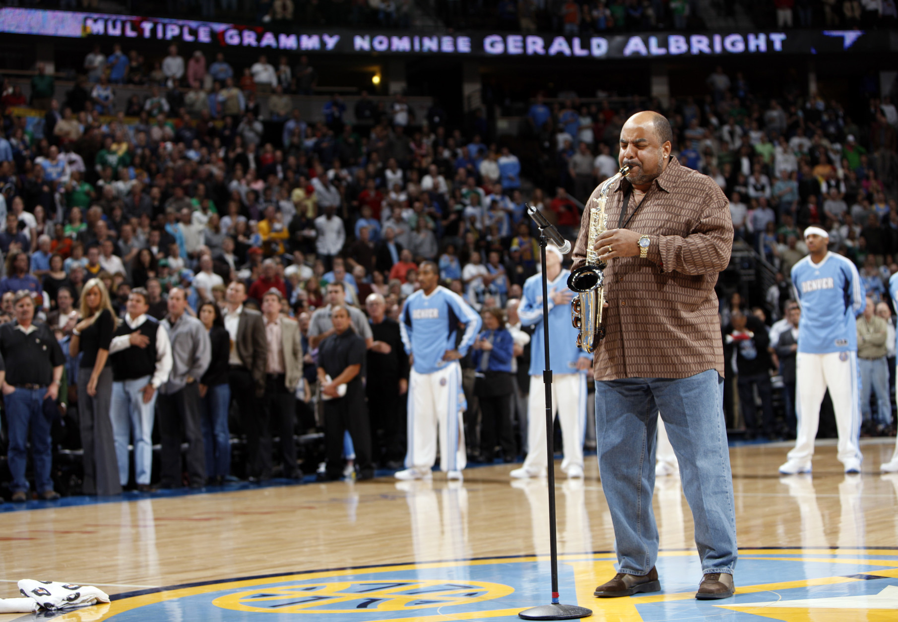 Gerald Albright plays the National Anthem before the Denver Nuggets face the Boston Celtics in the first quarter of an NBA basketball game in Denver on Monday, Feb. 23, 2009. (AP Photo/David Zalubowski)