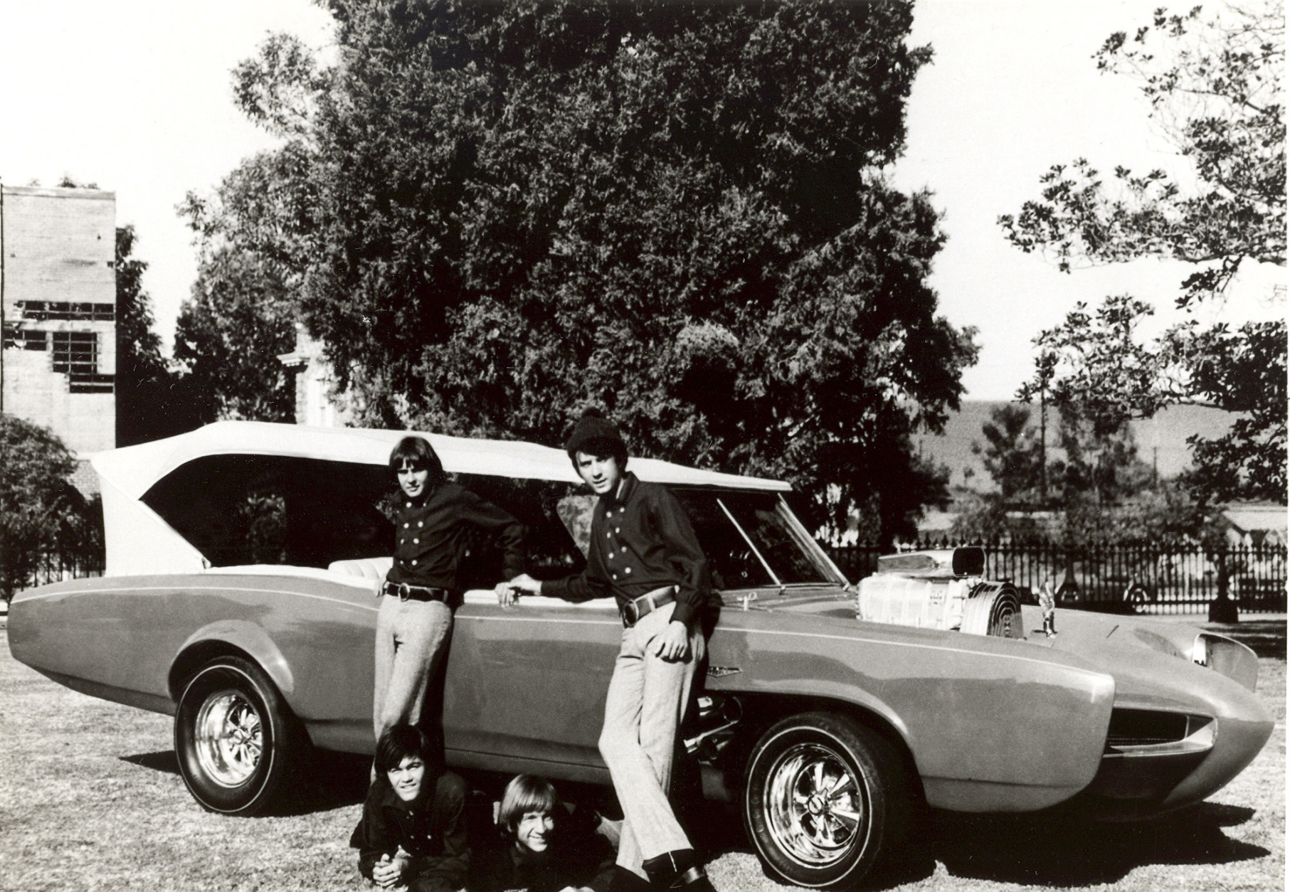 FILE - In this 1966 file photo, cast members of the television show "The Monkees," from top left, Davy Jones, Michael Nesmith, from lower left, Micky Dolenz, and Peter Tork pose next to their customized Pontiac GTO. Jones died Wednesday Feb. 29, 2012 in Florida. He was 66. Jones rose to fame in 1965 when he joined The Monkees, a British popular rock group formed for a television show. Jones sang lead vocals on songs like "I Wanna Be Free" and "Daydream Believer."    (AP Photo/File)