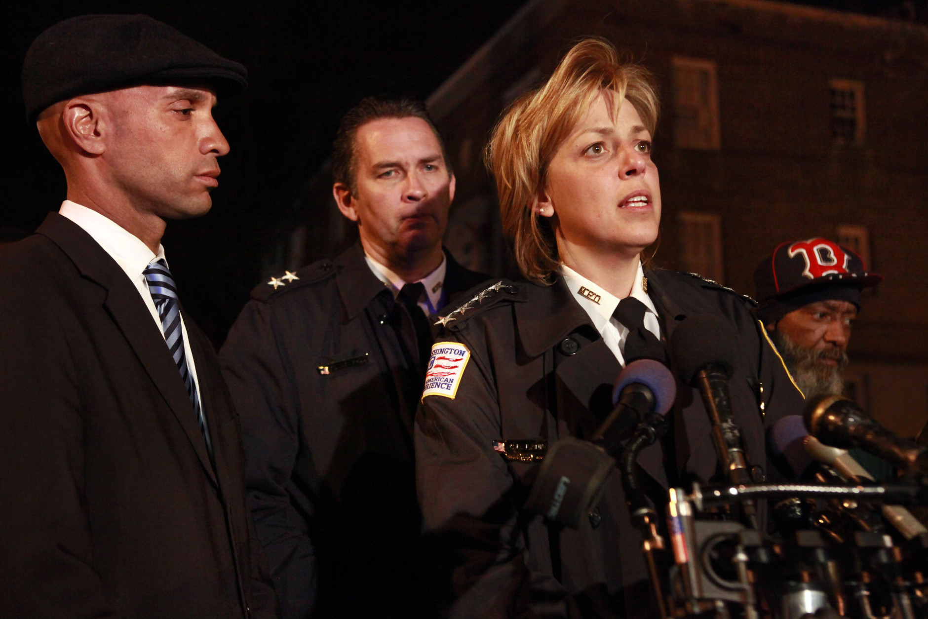 District of Columbia Mayor Adrian Fenty, left, Assistant Police Chief Peter Newsham, and Police Chief Cathy Lanier speak about the shooting of ten people, of whom four died, in Washington, on Wednesday, March 31, 2010. At right is William Cheek, grandfather of one of the victims. (AP Photo/Jacquelyn Martin)