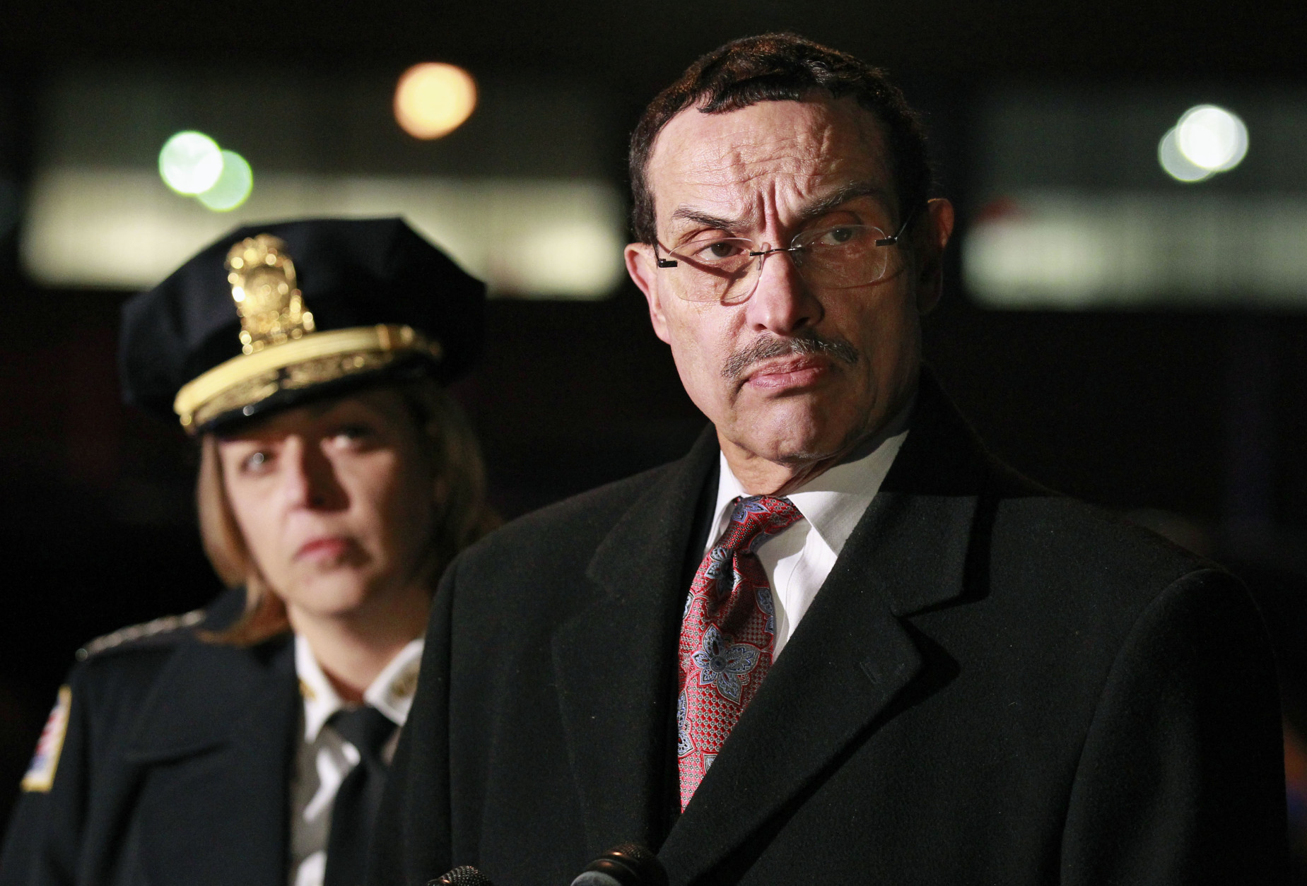 Washington Mayor Vincent Gray, right, and Chief of Police Cathy Lanier, talk with the media near a postal sorting facility in Washington, Friday, Jan. 7, 2011. A package ignited at the facility, a day after fiery packages sent to Maryland's governor and transportation secretary burned the fingers of workers who opened them.(AP Photo/Alex Brandon)