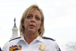 FILE - In this Oct. 3, 2013 file photo, Washington Police Chief Cathy Lanier speaks on Capitol Hill in Washington. Police officials in the nations capital have been facing recent questions about headline-making arrests _ not of hardened street criminals but of their own officers. In a single month, one District of Columbia police officer was accused of taking semi-nude pictures of a 15-year-old runaway and another was charged with running a prostitution operation involving teenage girls. A third was indicted on an attempted murder charge, accused of striking his wife in the head with a light fixture. (AP Photo/Molly Riley, File)