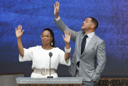 Oprah Winfrey and Will Smith waves to guest in the attendance before speaking at the dedication ceremony for the Smithsonian Museum of African American History and Culture on the National Mall in Washington, Saturday, Sept. 24, 2016. (AP Photo/Pablo Martinez Monsivais)