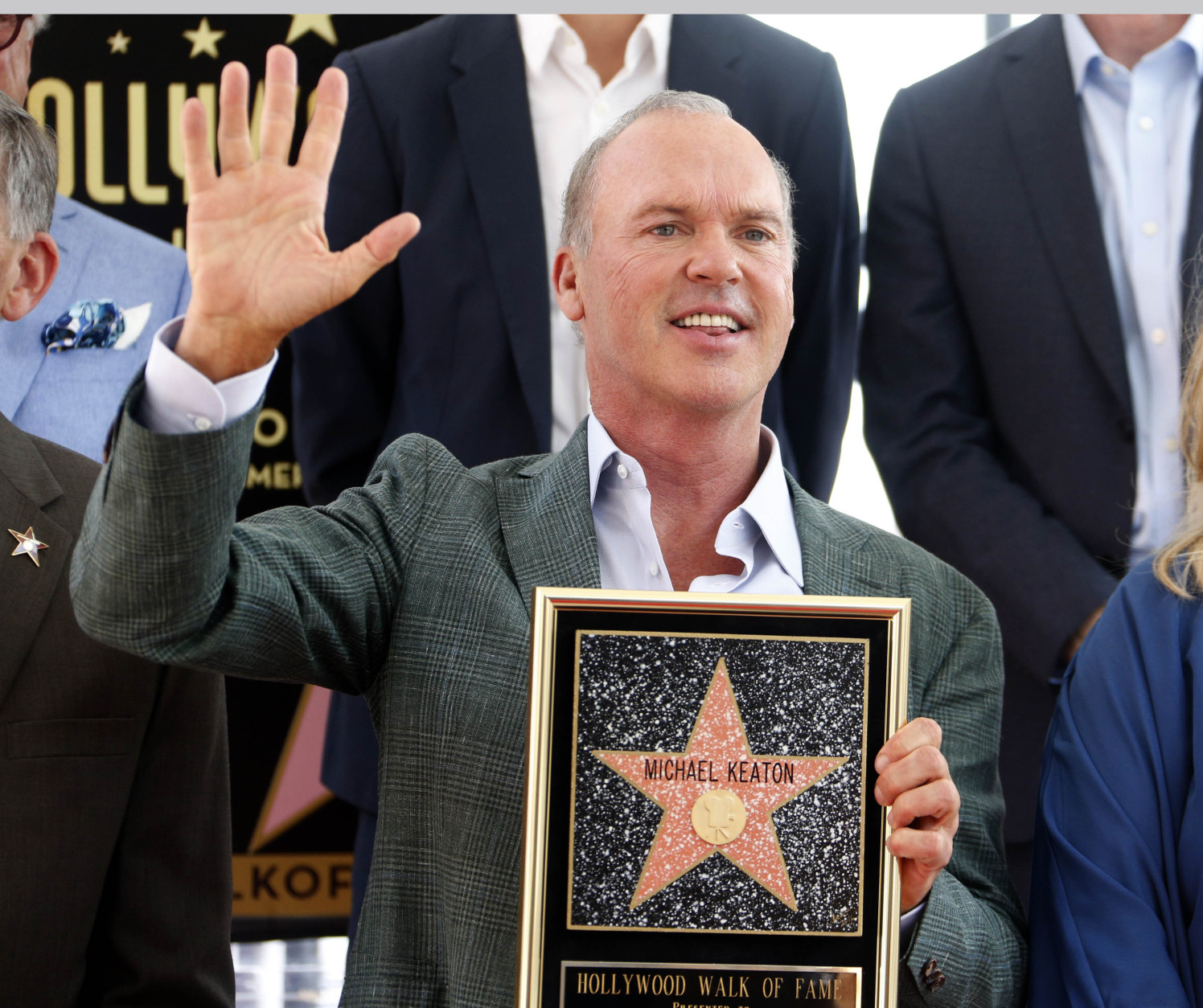Academy Award winning actor Michael Keaton waves at a ceremony awarding him with a star on the Hollywood Walk of Fame in Los Angeles, Thursday, July 28, 2016. (AP Photo/Nick Ut)