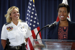 Washington police chief Cathy Lanier smiles at left as Washington Mayor Muriel Bowser speaks during a news conference, Tuesday, Aug. 16, 2016, in Washington. Lanier is stepping down to become head of security for the National Football League. (AP Photo/Alex Brandon)