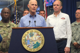 Florida Gov. Rick Scott, center, and Florida Emergency Management Director Bryan Koon, right, give an update on Tropical Storm Hermine at the State Disaster Operations Center in Tallahassee, Fla., on Thursday, Sept. 1, 2016. Scott says Tropical Storm Hermine is potentially life-threatening, and he's urging Gulf Coast residents to take precautions immediately.
(AP Photo/Joe Reedy)