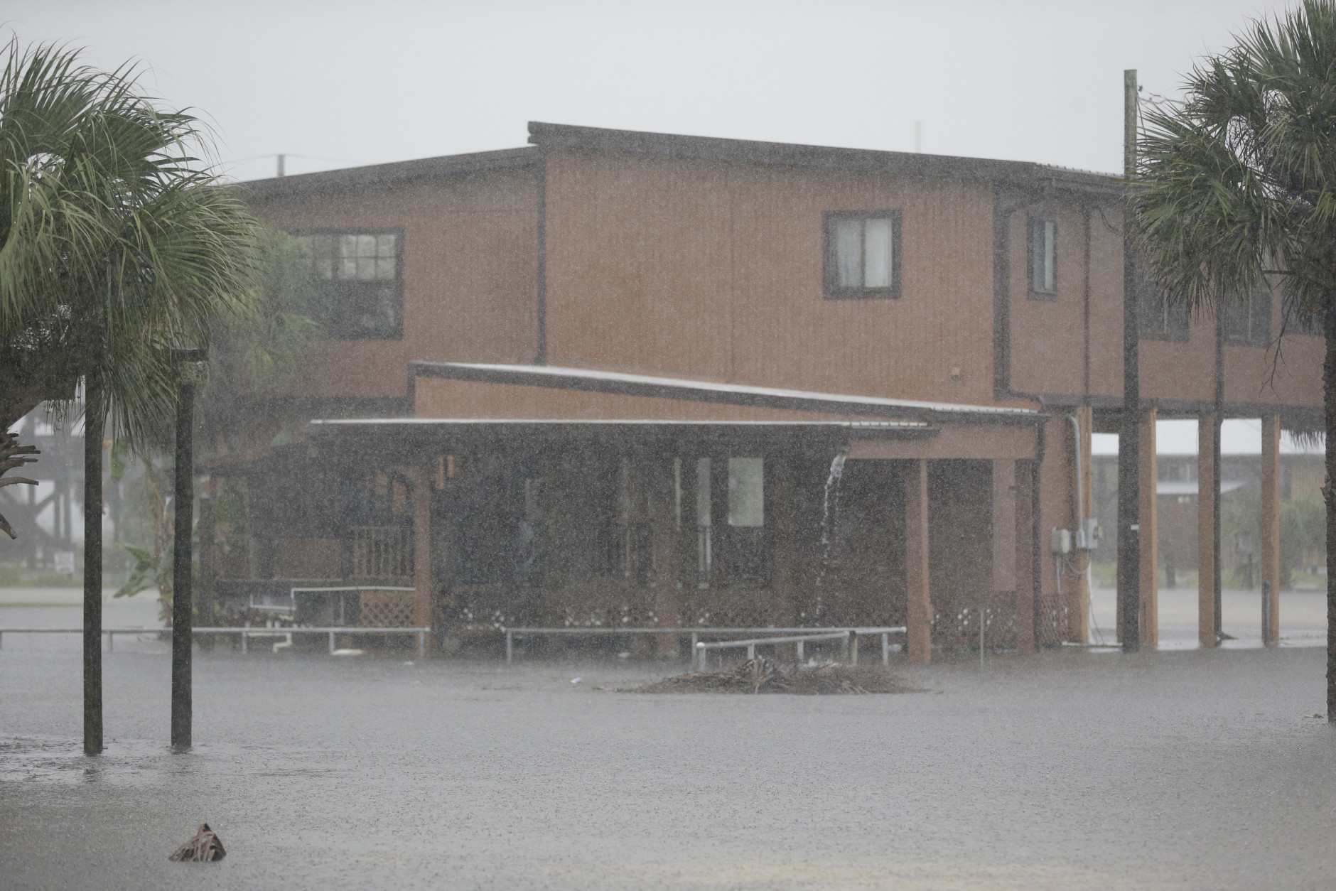 Ground water begins to flood some low areas as Tropical Storm Hermine heads inland Thursday, Sept. 1, 2016, in Dekle Beach, Fla. A hurricane warning was in effect for Florida's Big Bend from the Suwannee River to Mexico Beach.(AP Photo/John Raoux)