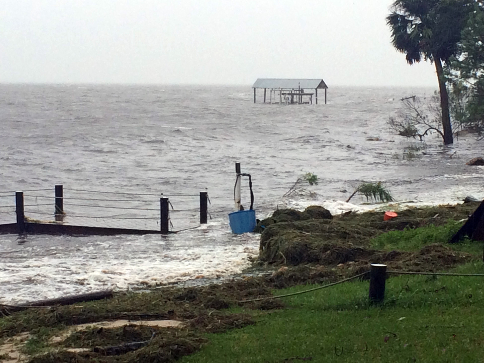 In this image made from a video, rough surf smashes against a dock as Hurricane Hermine nears the Florida coast, Thursday, Sept. 1, 2016, in Carabelle, Fla. Hurricane Hermine gained new strength Thursday evening as it roared closer to Florida's Gulf Coast and people braced for the first direct hit on the state from a hurricane in over a decade. (AP Photo/Joshua Replogle)