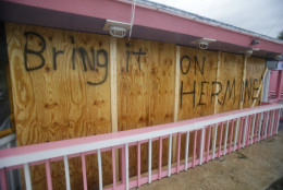 A hand painted sign on a boarded up bar is seen as Hurricane Hermine nears the Florida coast, Thursday, Sept. 1, 2016, in Cedar Key, Fla. ﻿Hurricane Hermine gained new strength Thursday evening and roared ever closer to Florida's Gulf Coast, where rough surf began smashing against docks and boathouses and people braced for the first direct hit on the state from a hurricane in over a decade. ﻿(AP Photo/John Raoux)