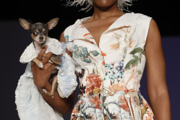 The Anthony Rubio canine couture and woman's wear collection is modeled during Fashion Week in New York, Friday, Sept. 9, 2016. (AP Photo/Mary Altaffer)