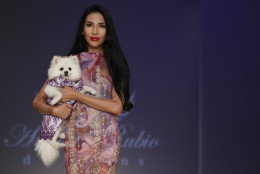 The Anthony Rubio canine couture and woman's wear collection is modeled during Fashion Week in New York, Friday, Sept. 9, 2016. (AP Photo/Mary Altaffer)