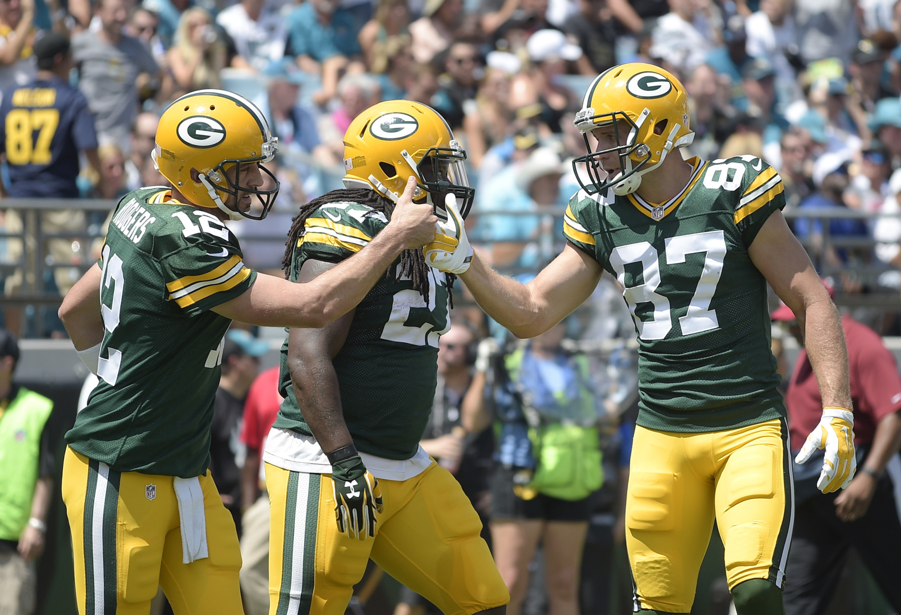 Green Bay Packers quarterback Aaron Rodgers celebrates his touchdown run against the Jacksonville Jaguars with wide receiver Jordy Nelson (87) during the first half of an NFL football game in Jacksonville, Fla., Sunday, Sept. 11, 2016.(AP Photo/Phelan M. Ebenhack)
