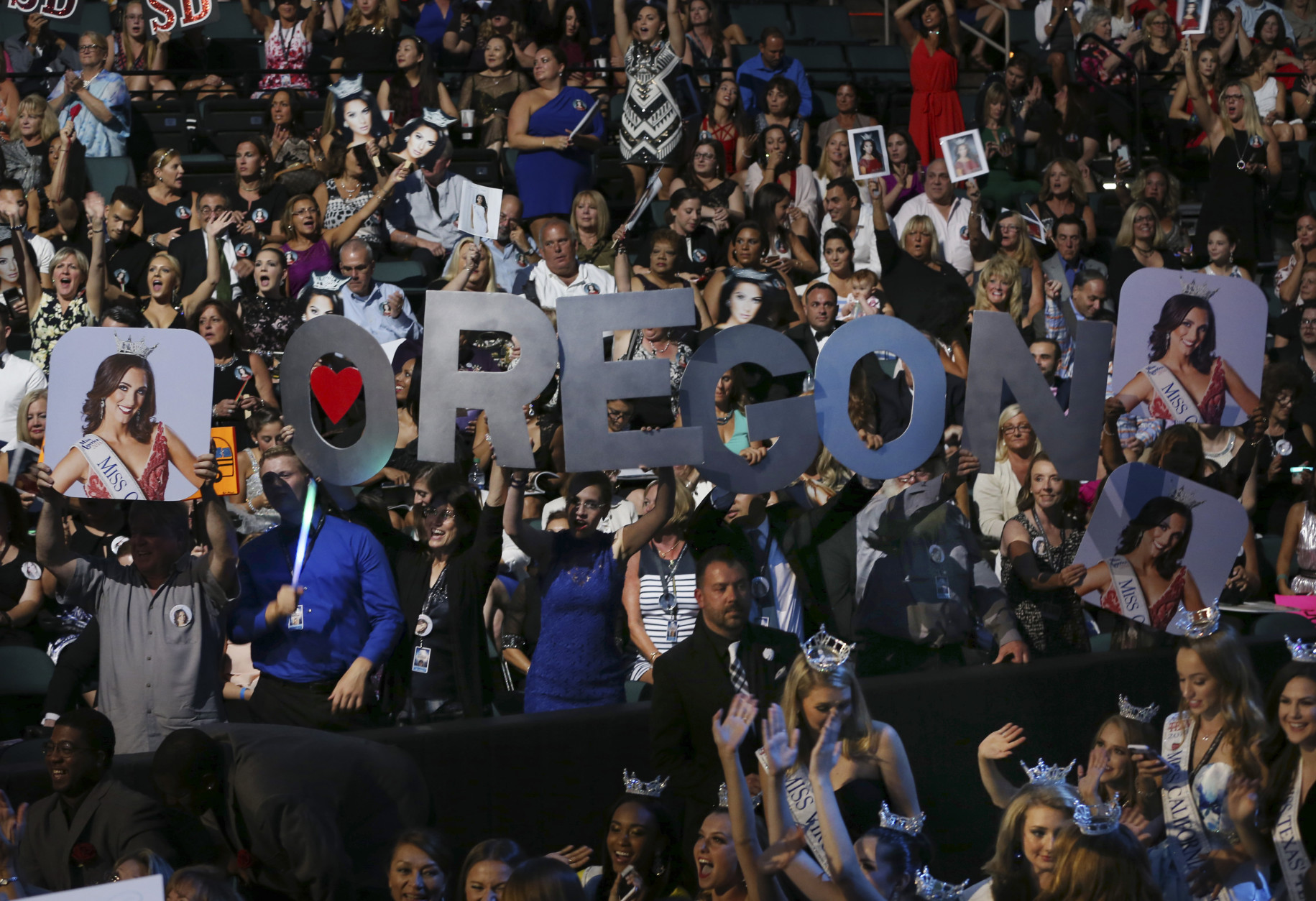 Fans of Miss Oregon Alexis Mather, hold up a sign during the Miss America 2017 pageant, Sunday, Sept. 11, 2016, in Atlantic City, N.J. (AP Photo/Mel Evans)