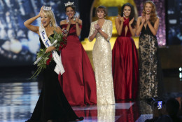 The Miss America winner Miss Arkansas Savvy Shields, holds onto her crown during the Miss America 2017 pageant, Sunday, Sept. 11, 2016, in Atlantic City, N.J. (AP Photo/Mel Evans)