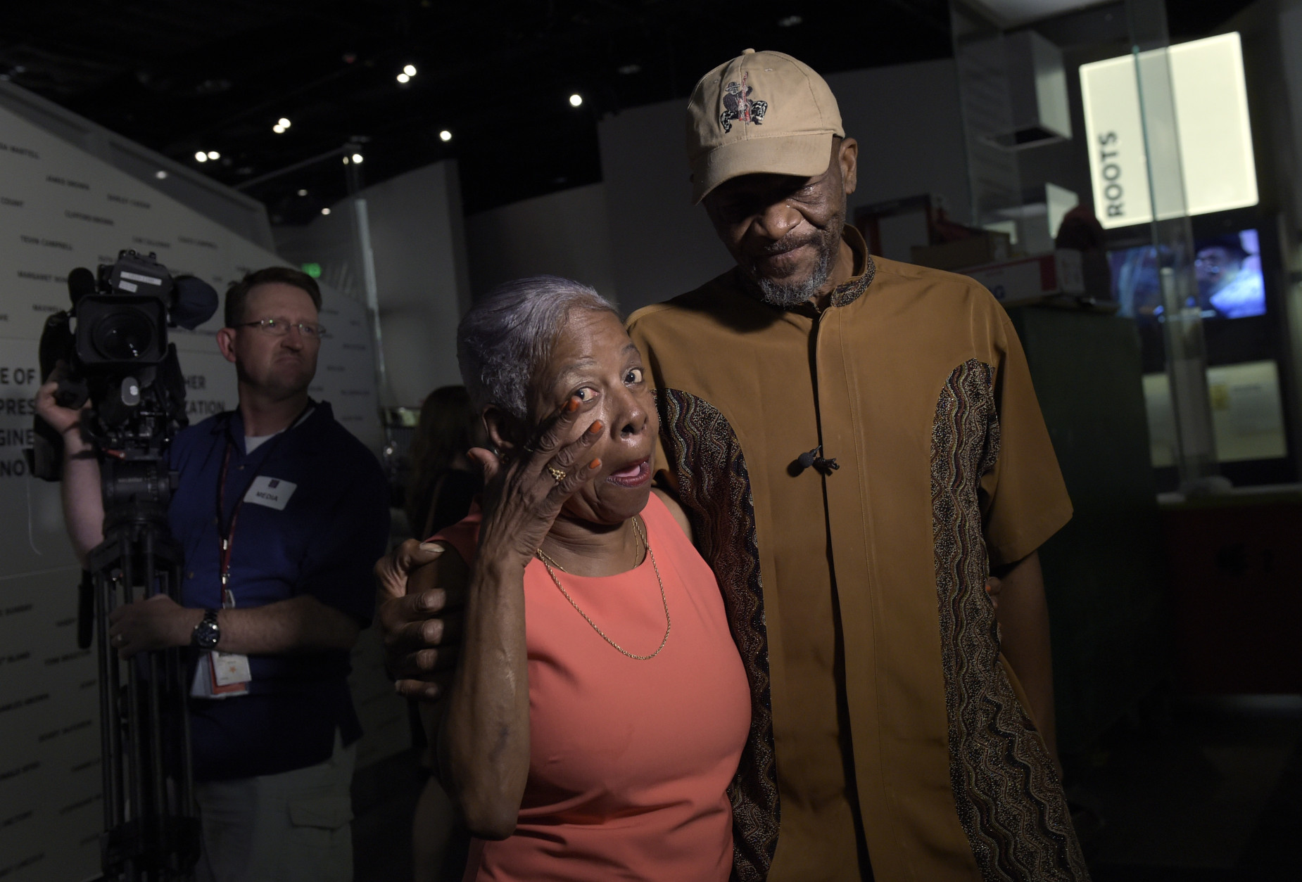 Gloria Jolivet, a niece-in-law to Bo Diddley, left, and Ellis McDaniel, Jr., right, son of Bo Diddley, stop to look at the exhibited space dedicated to Bo Diddley at the National Museum of African American History and Culture in Washington, Wednesday, Sept. 14, 2016, during a press preview. (AP Photo/Susan Walsh)