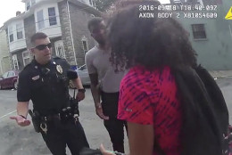 In this Sunday, Sept. 18, 2016 video frame grab from a body camera released by the Hagerstown (Md.) police, an officer speaks with a 15-year-old girl in Hagerstown, Md. An officer pepper-sprayed the 15-year-old girl in a police cruiser when she refused to put her feet inside. A police spokesman says several officers involved in the pepper-spray arrest of a 15-year-old girl remain on duty while the department investigates.  (Hagerstown (Md.) police via AP)