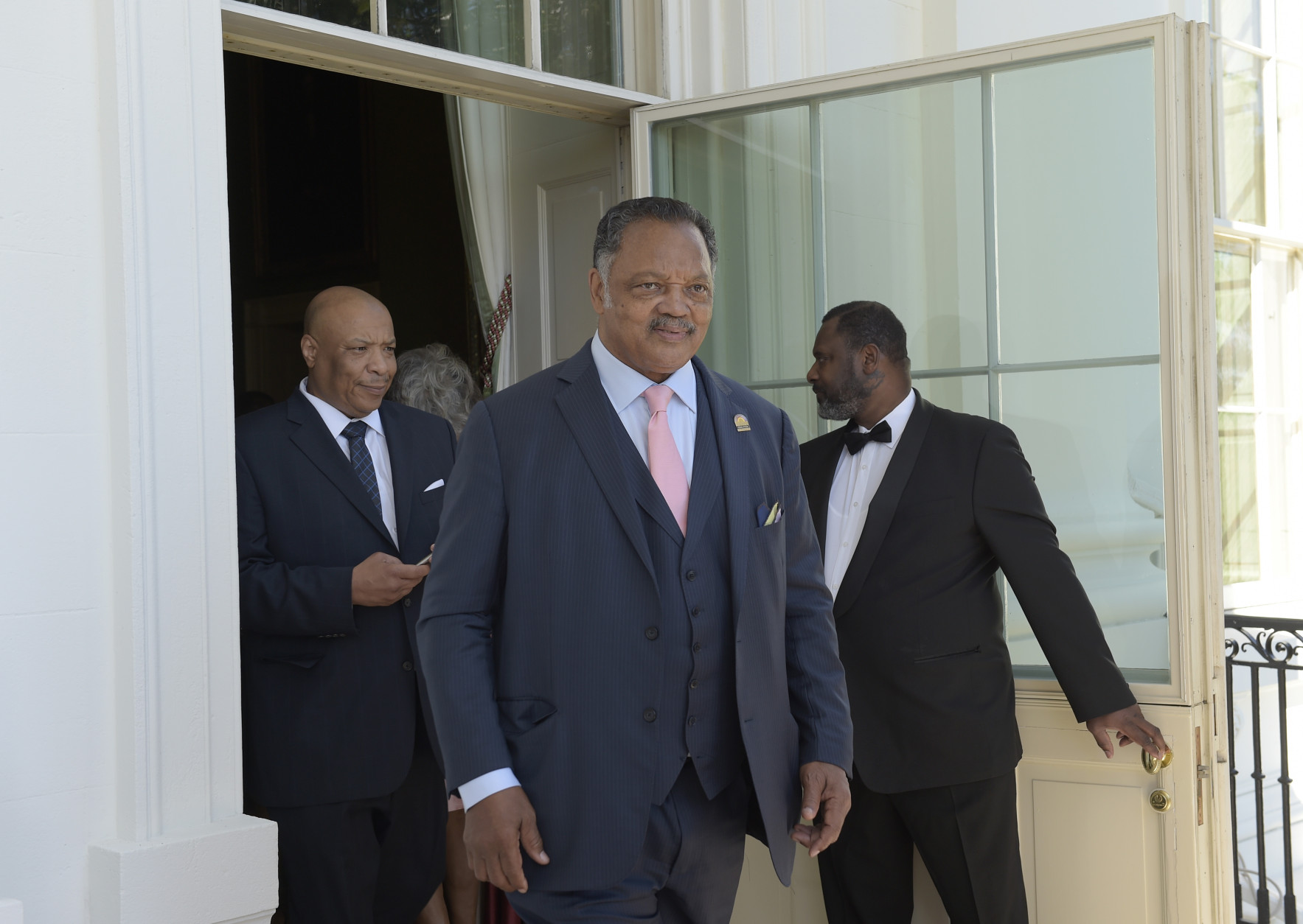 Rev. Jesse Jackson walks onto the Truman Balcony of the White House in Washington, Friday, Sept. 23, 2016, as he attends a reception for the opening of the Smithsonian's National Museum of African American History and Culture. (AP Photo/Susan Walsh)