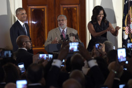 President Barack Obama, left, and first lady Michelle Obama, right, listen as Lonnie Bunch, center, Director of the Smithsonian Museum of African American History and Culture, speaks at a reception for the museum opening at the White House in Washington, Friday, Sept. 23, 2016. (AP Photo/Susan Walsh)