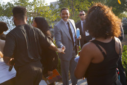 Actor Will Smith, center, stops to greet performers for today's dedication ceremony at the Smithsonian Museum of African American History and Culture on the National Mall in Washington, Saturday, Sept. 24, 2016. (AP Photo/Pablo Martinez Monsivais)