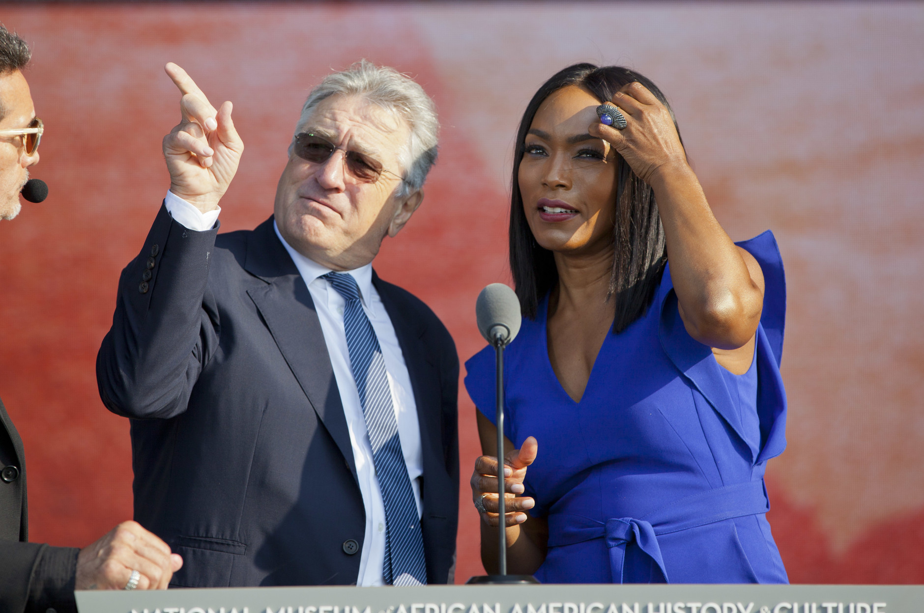 Actors Robert De Niro, left, and Angela Bassett, stand on stage during a sounds check before the dedication ceremony of the Smithsonian Museum of African American History and Culture on the National Mall in Washington, Saturday, Sept. 24, 2016. (AP Photo/Pablo Martinez Monsivais)