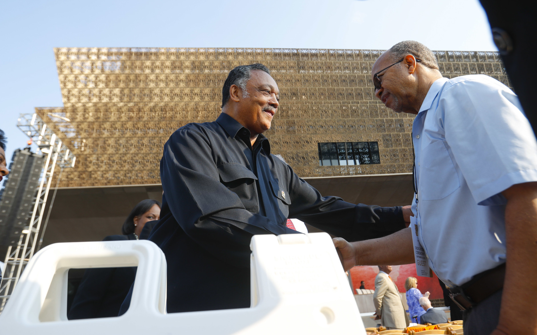 Rev. Jesse Jackson greets guests as they take their seats for the dedication ceremony of the Smithsonian Museum of African American History and Culture on the National Mall in Washington, Saturday, Sept. 24, 2016. (AP Photo/Pablo Martinez Monsivais)