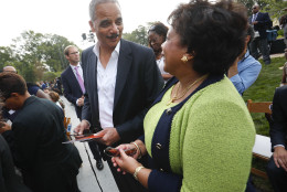Former Attorney General Eric Holder, left, talks with current Attorney General Loretta Lynch as they arrive for the dedication ceremony of the Smithsonian Museum of African American History and Culture on the National Mall in Washington, Saturday, Sept. 24, 2016. (AP Photo/Pablo Martinez Monsivais)