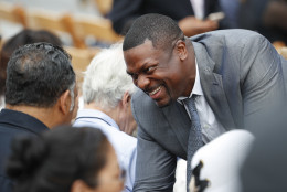 Actor Chris Tucker, right, stops to talk with Rev. Jesse Jackson Sr., as they take their seats for the dedication ceremony of the Smithsonian Museum of African American History and Culture on the National Mall in Washington, Saturday, Sept. 24, 2016. (AP Photo/Pablo Martinez Monsivais)